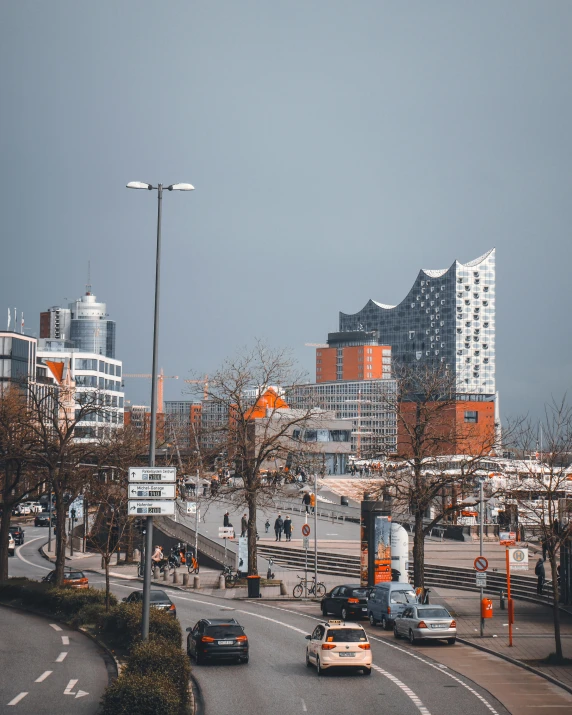 traffic and buildings on a city street at an intersection