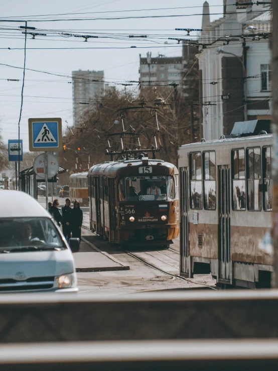 the trolley is pulling away from the station to pass through the cars