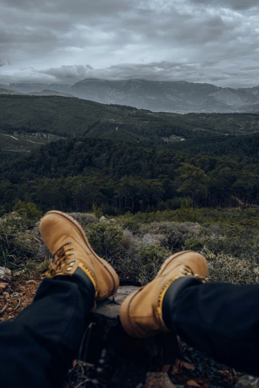 a pair of boots that are in front of a person