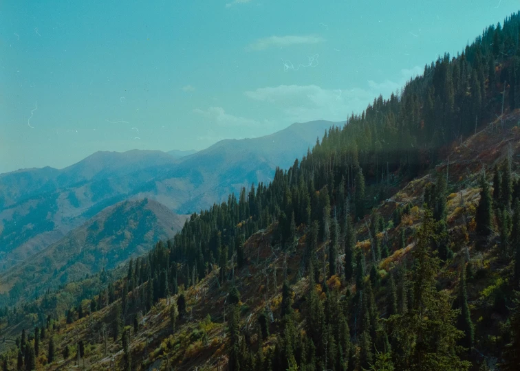 a blue sky that is very distant above some mountains