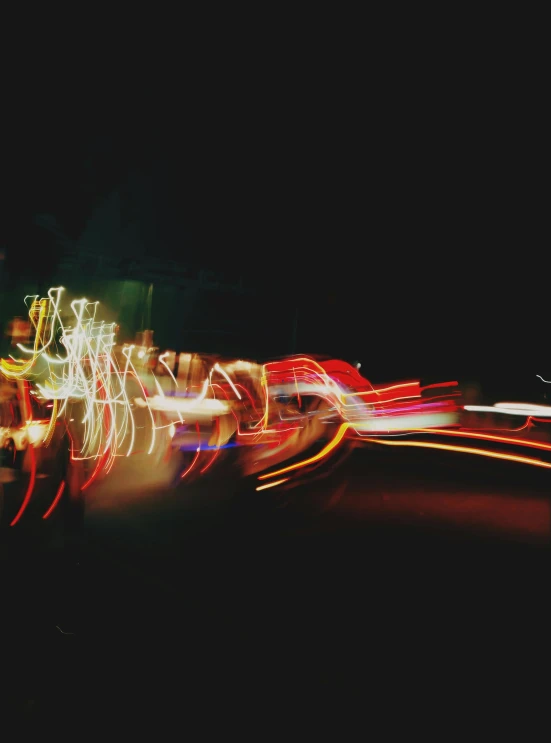 a picture of traffic at night taken with long exposure