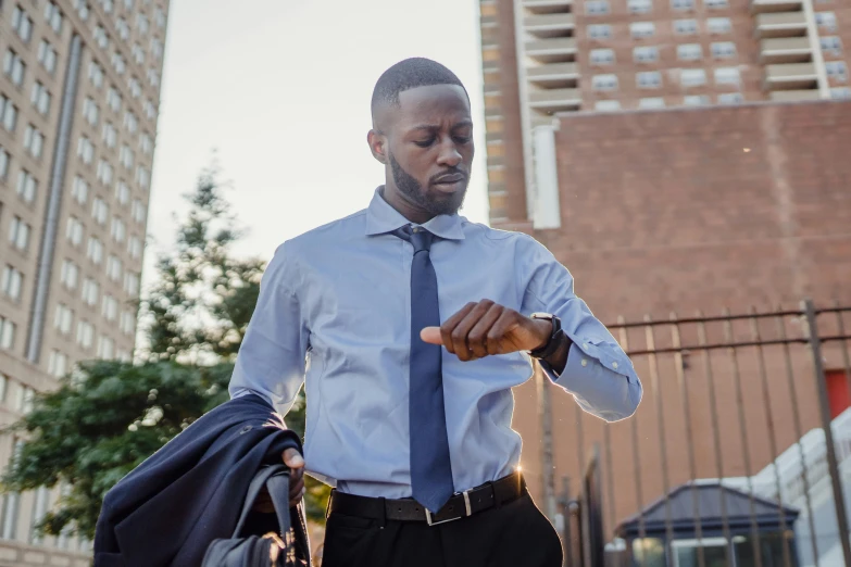 a man in a blue tie with black pants