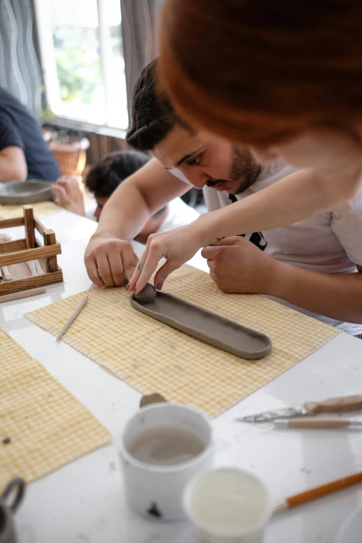 a person making a cut with a large knife