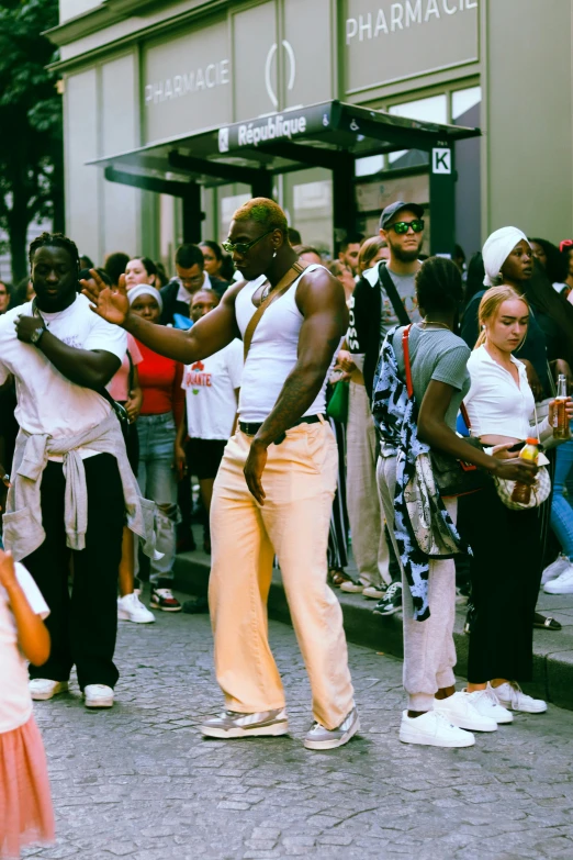 a man and woman dance on the street