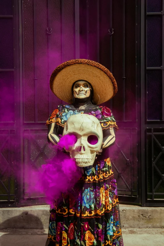 a skeleton dressed up in a frock and a sombrero