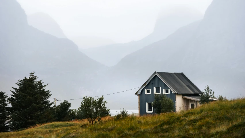 a small house on the side of a hill