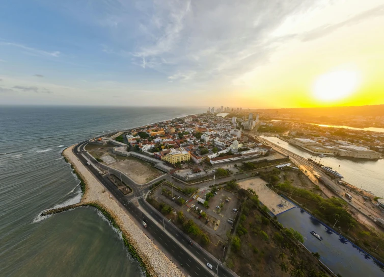 an aerial view of the ocean and the city