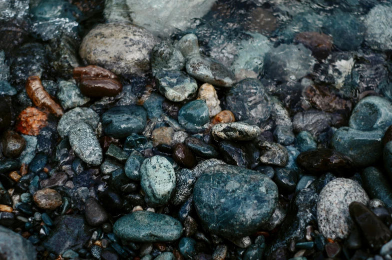 some stones and rocks together near a body of water