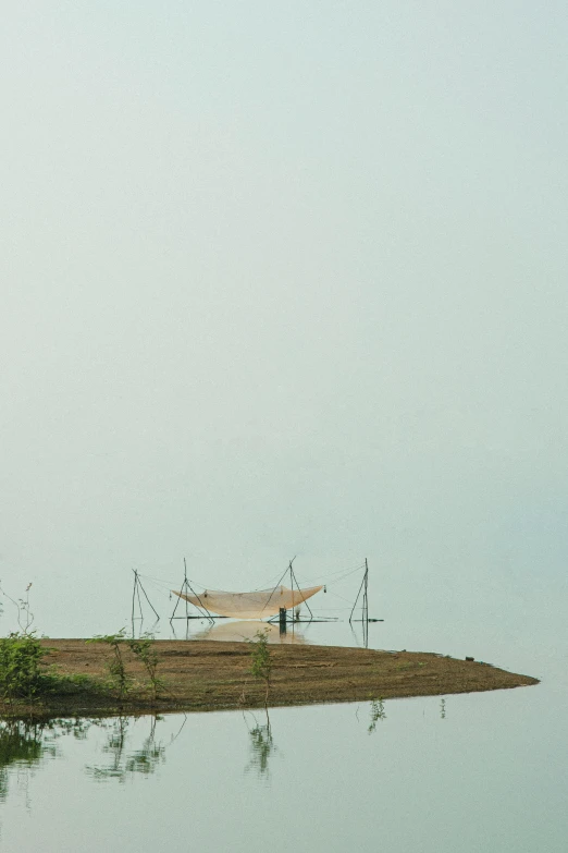 an airplane is parked on the edge of a body of water