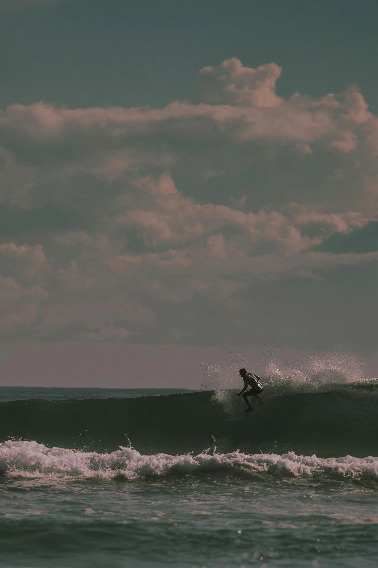 the surfer is riding a wave in the ocean