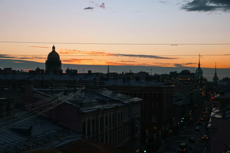 a sunset view of a city and buildings