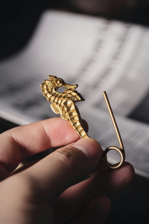 a person holding a gold key in their left hand