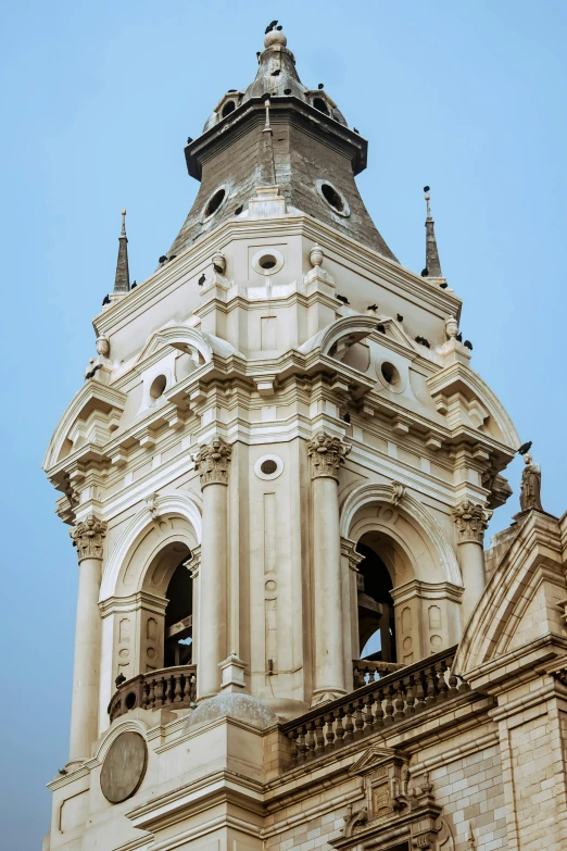 a very tall building with two windows and a clock