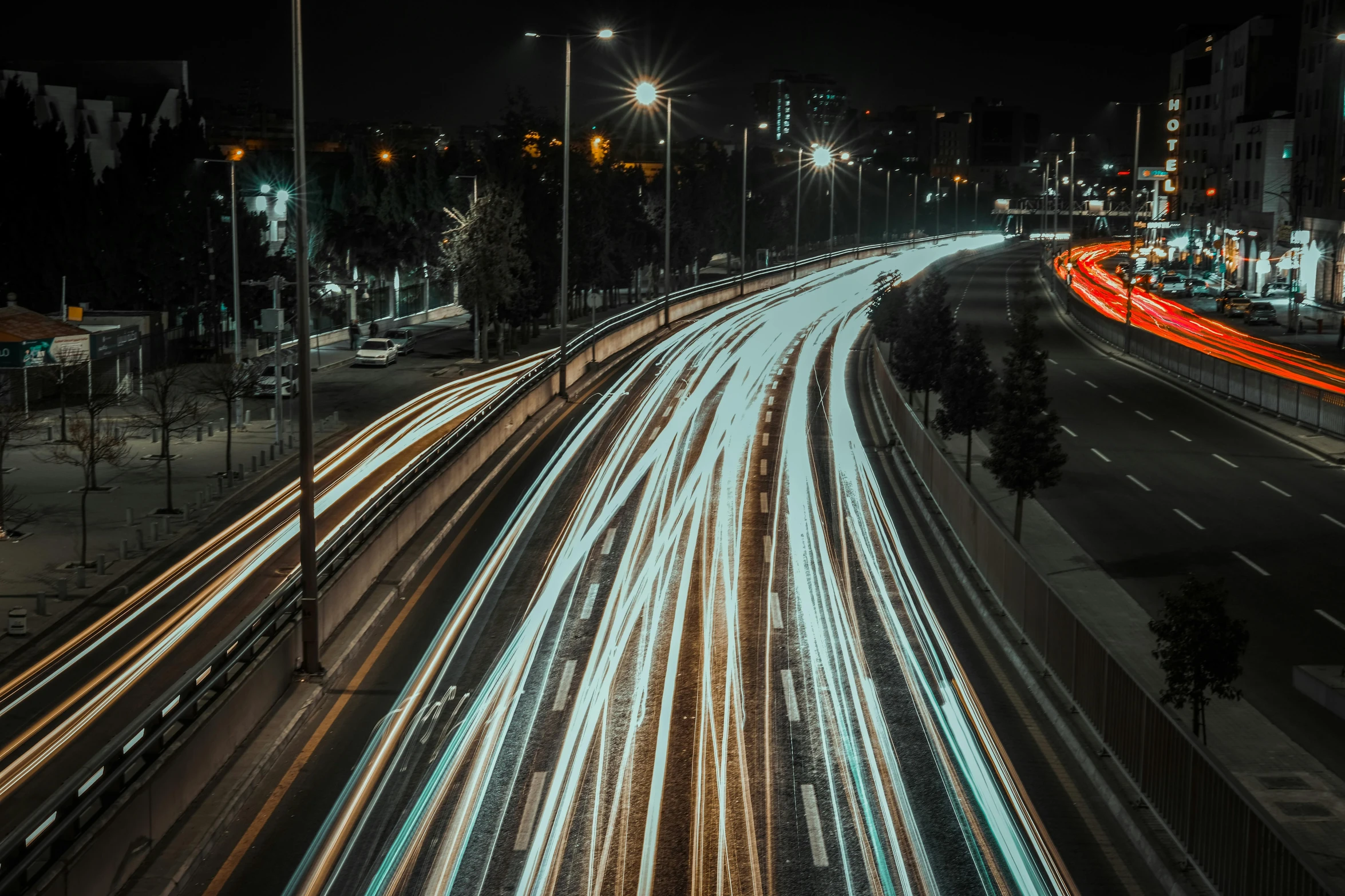 light trails form on the street at night