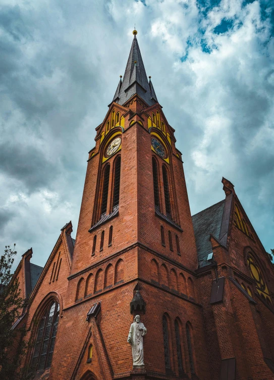 an old brick church against the blue sky