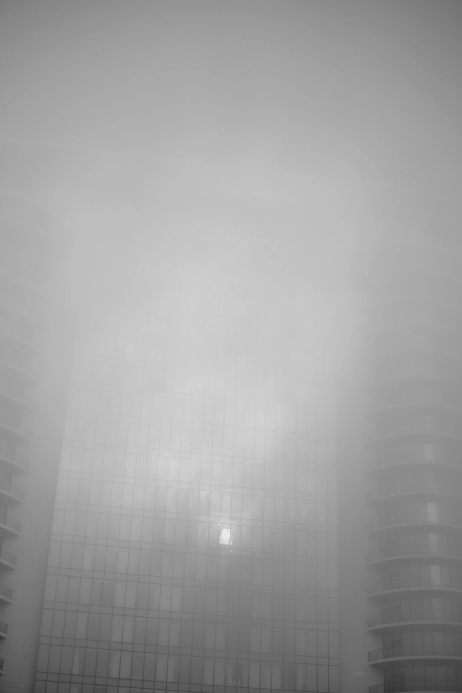 fog in front of two very tall buildings