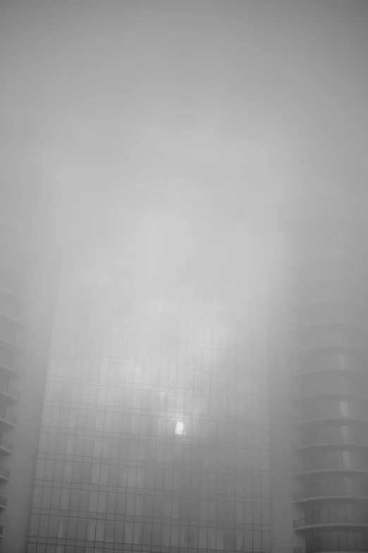 fog in front of two very tall buildings