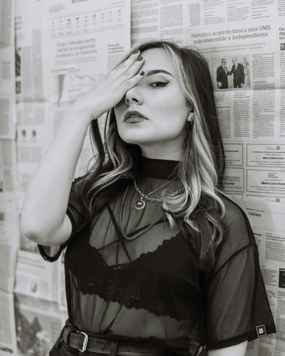 a woman poses for a black and white picture