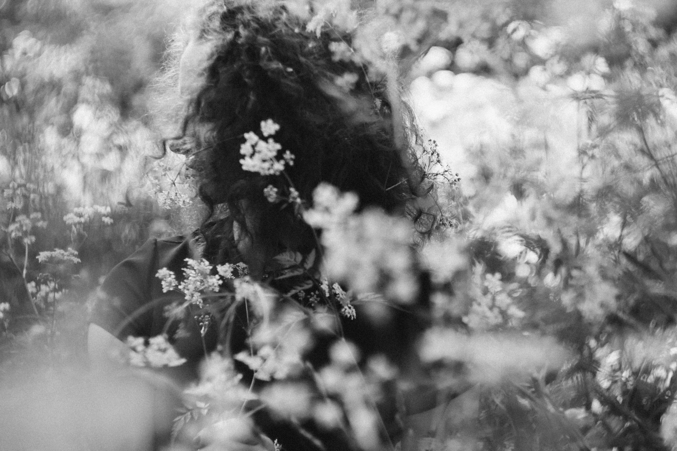 an image of a woman surrounded by flowers