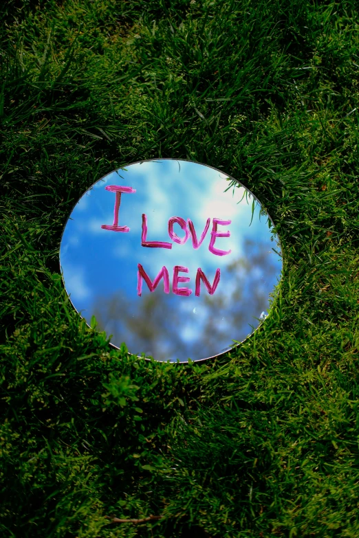 a glass sign with writing on it that says i love men
