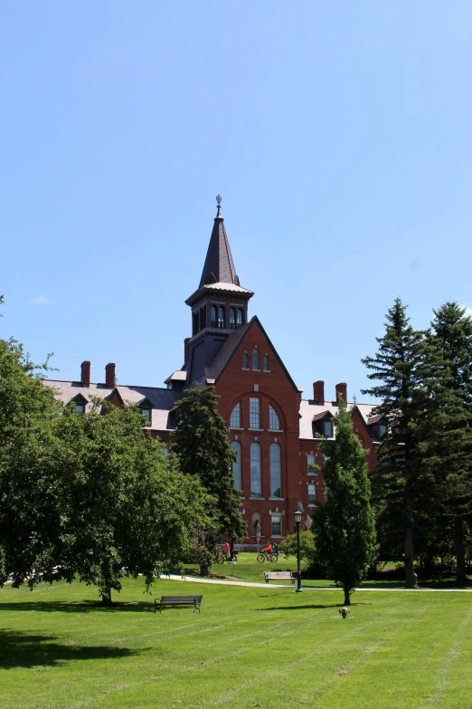 an older red brick building with a steeple