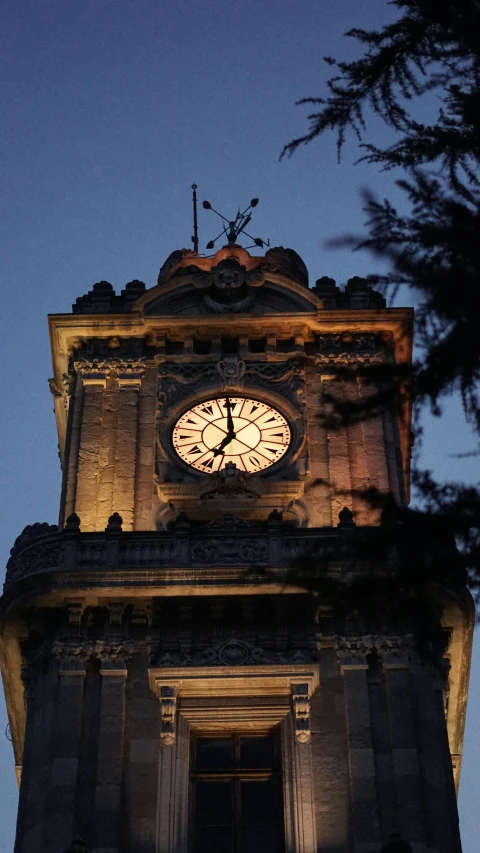 an image of a clock tower that has a lot of lights