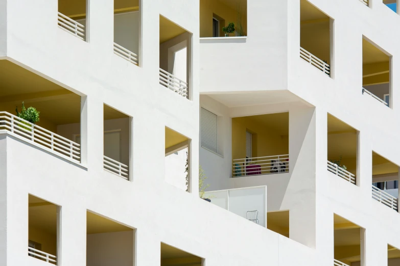 several balconies of a large white building