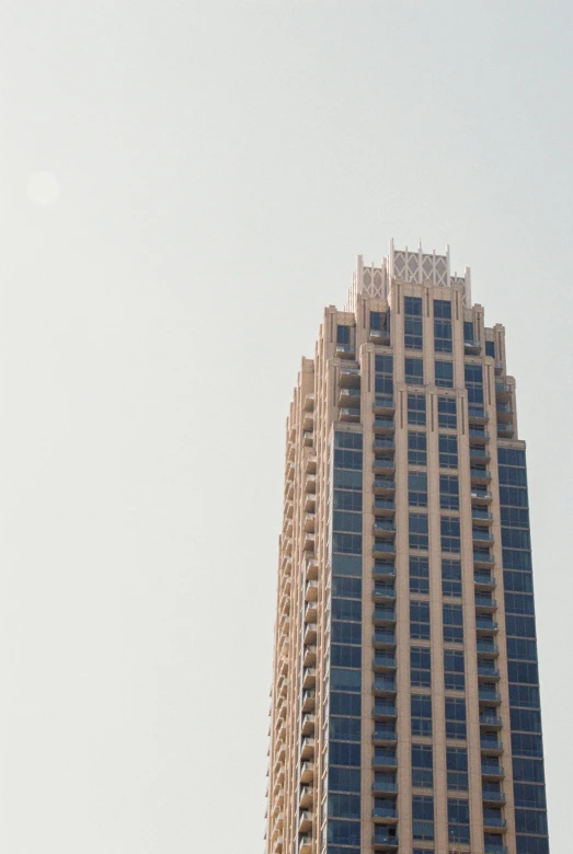 a very tall building towering over a city