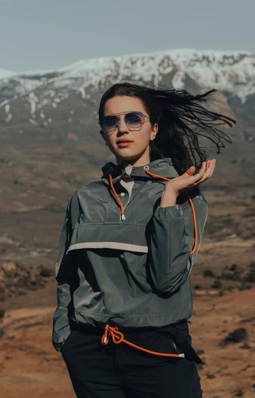 woman with wild hair blowing in wind during daytime