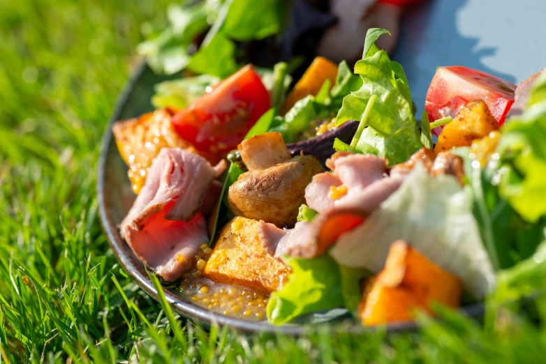 a stainless steel bowl holding some salads