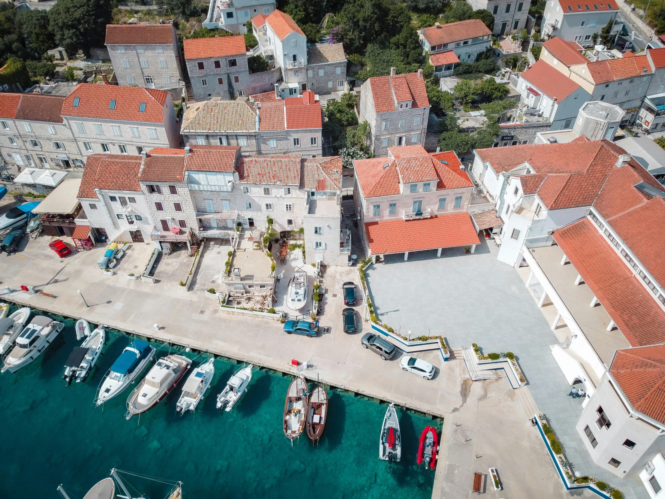 an aerial s of some small boats docked in the water