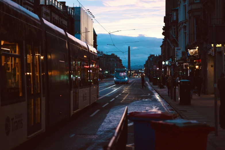 a car on a city street with some buildings in the background