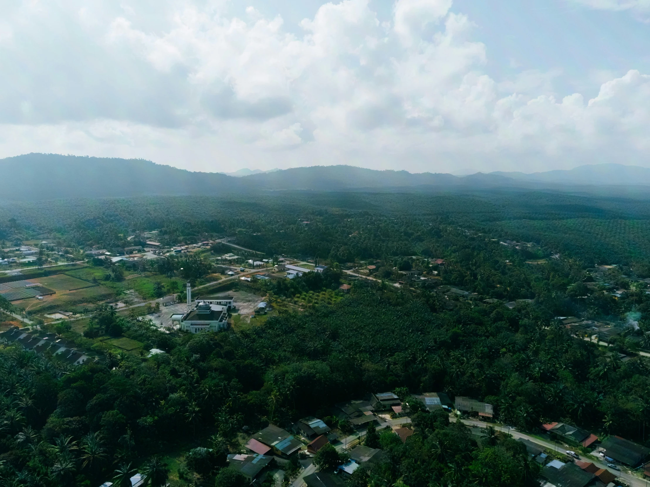 aerial s of several small town in the distance