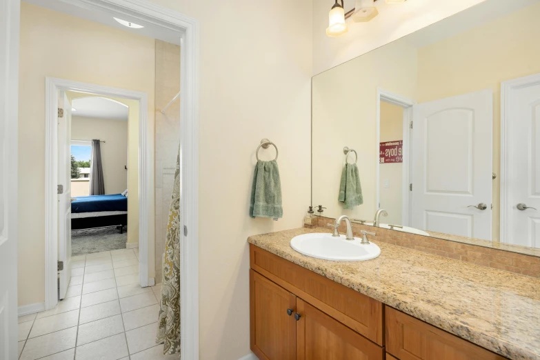 a large bathroom with an interesting sink in it