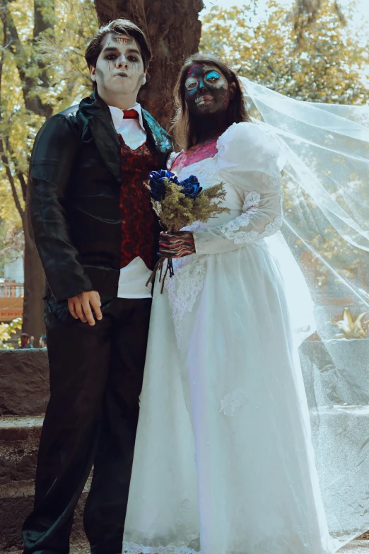 a man and woman in their wedding costumes