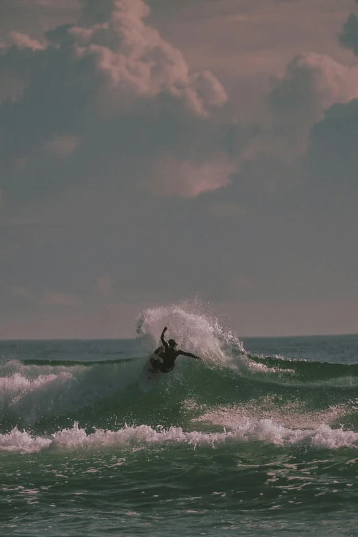 a person riding the waves on their surfboard