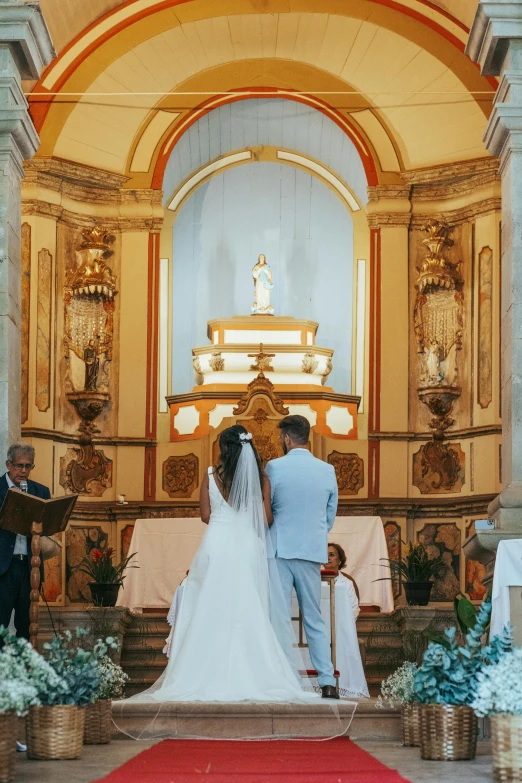 bride and groom walking down the aisle of a church