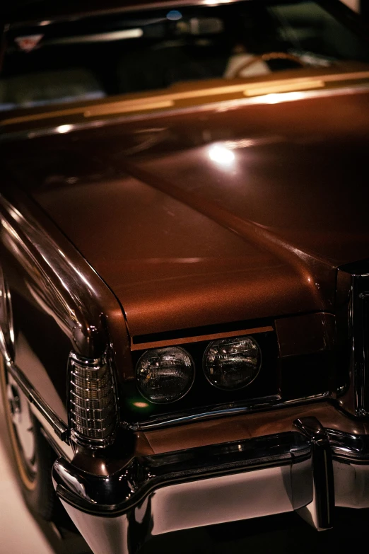 an older fashioned car sitting on the street