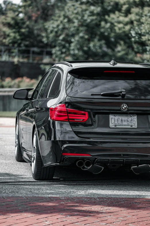 an grey bmw car parked outside in a parking lot