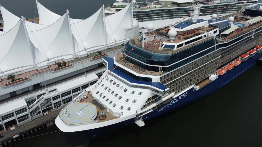 a large cruise ship that is docked next to another cruise ship