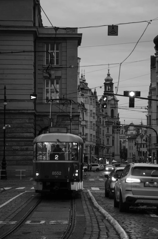 a train moves down the tracks through an urban area