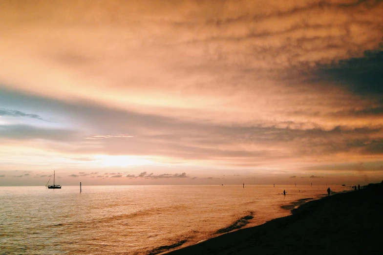 sunset at the ocean with the sky in view