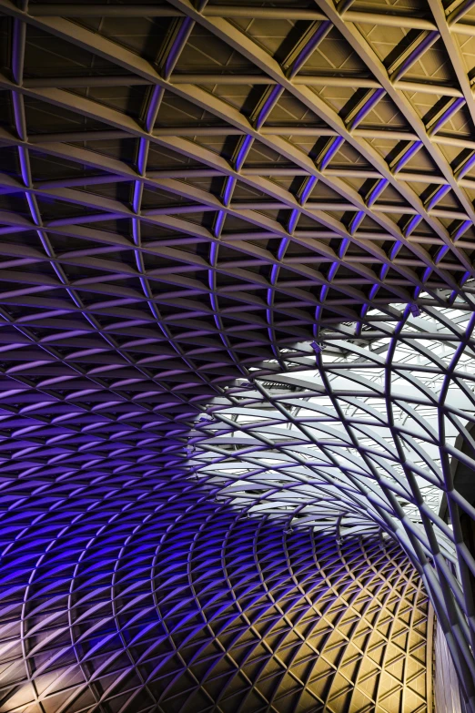 the ceiling in a large building with blue lighting