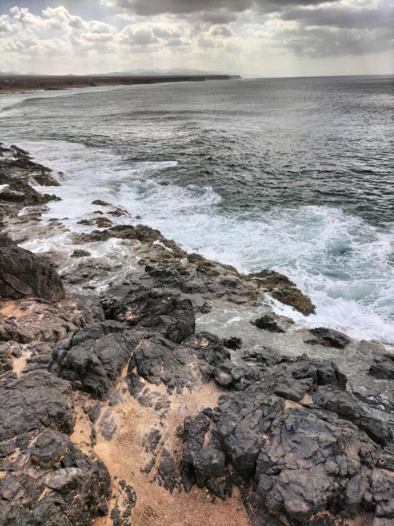 a view of an ocean and some rocks