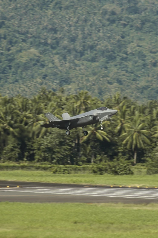 an air plane is flying low over the ground