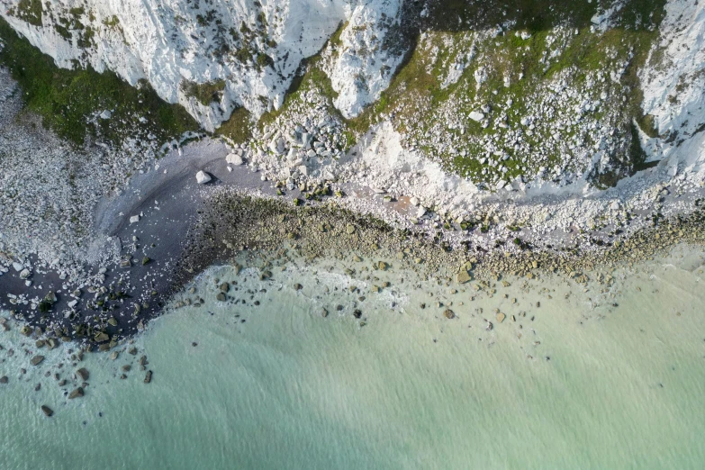 a po taken from an aerial view of the sea and mountains