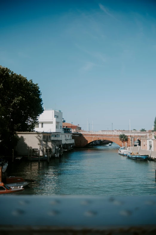 the view from the water of boats on the canal