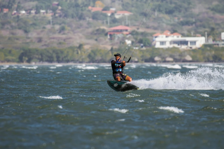 a man water skiing on a large body of water