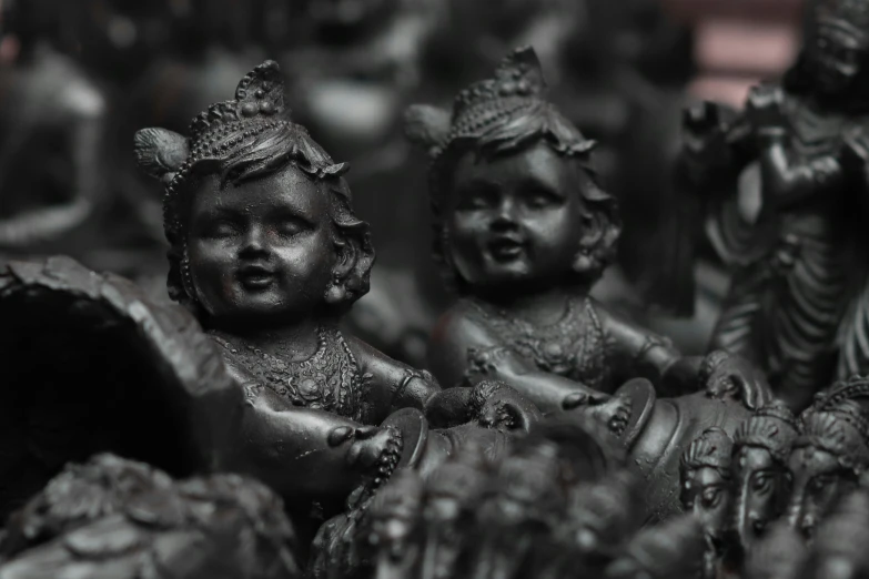 a group of black statues sitting next to each other