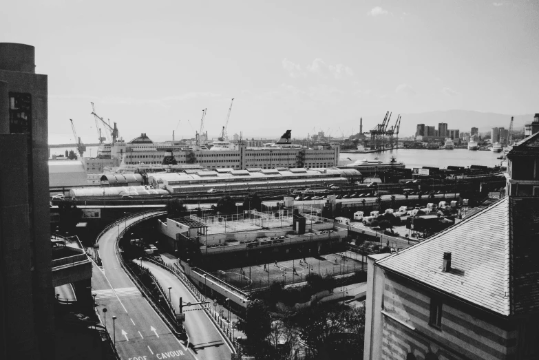 view of industrial building and river from roof of apartment building